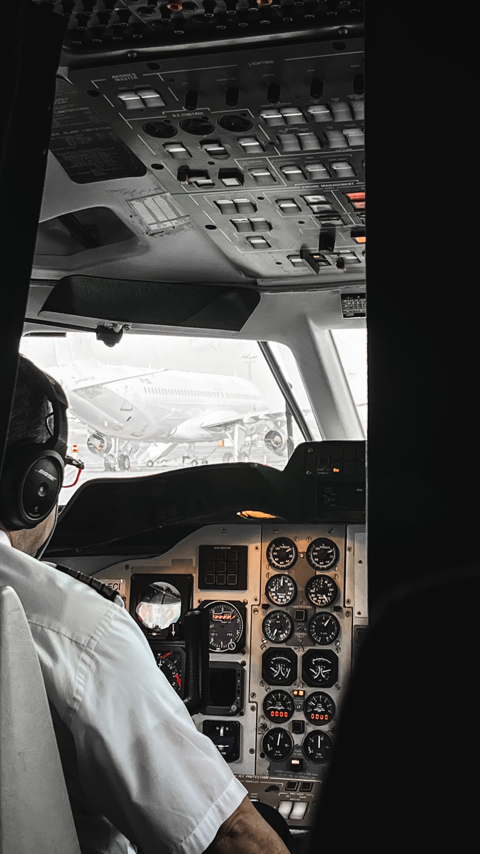 Pilot at the controls in the cockpit